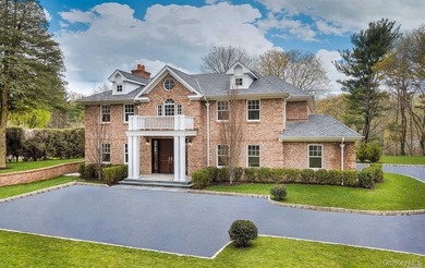Located in the prestigious Village of Roslyn Harbor, this - photo 1