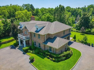Located in the prestigious Village of Roslyn Harbor, this - photo 3