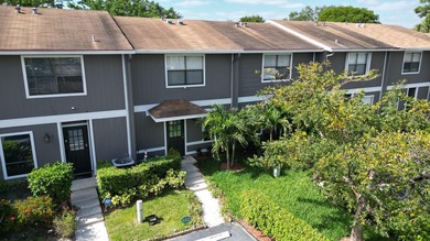 Welcome to this inviting 2-bedroom, 1.5-bath townhouse located - photo 2