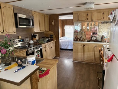 This home is located on the Canal to Lake Huntley and offers 3 - photo 13