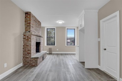 This attractive triplex has a beautifully restored facade that - photo 12