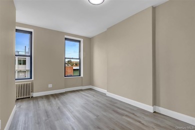 This attractive triplex has a beautifully restored facade that - photo 15