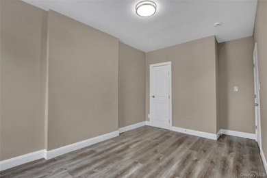 This attractive triplex has a beautifully restored facade that - photo 16