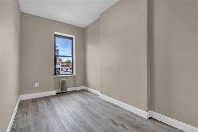 This attractive triplex has a beautifully restored facade that - photo 20