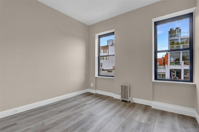 This attractive triplex has a beautifully restored facade that - photo 21