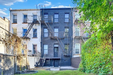 This attractive triplex has a beautifully restored facade that - photo 26
