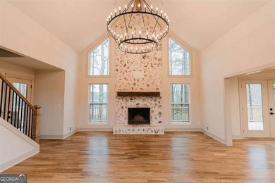 HUGE PRICE REDUCTION! LAKE HOME WITH 200 FEET OF SHORE LINE ON A - photo 2