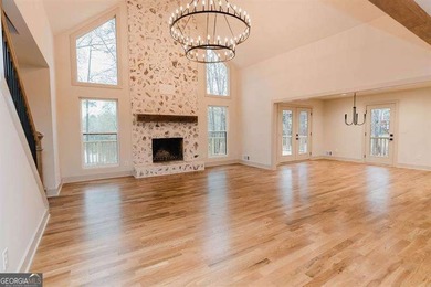 HUGE PRICE REDUCTION! LAKE HOME WITH 200 FEET OF SHORE LINE ON A - photo 3