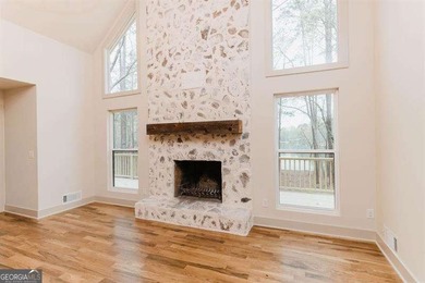 HUGE PRICE REDUCTION! LAKE HOME WITH 200 FEET OF SHORE LINE ON A - photo 4