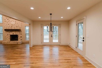 HUGE PRICE REDUCTION! LAKE HOME WITH 200 FEET OF SHORE LINE ON A - photo 5
