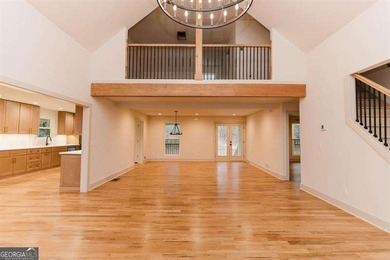 HUGE PRICE REDUCTION! LAKE HOME WITH 200 FEET OF SHORE LINE ON A - photo 7