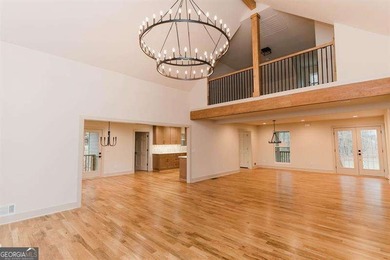 HUGE PRICE REDUCTION! LAKE HOME WITH 200 FEET OF SHORE LINE ON A - photo 8
