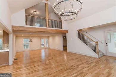 HUGE PRICE REDUCTION! LAKE HOME WITH 200 FEET OF SHORE LINE ON A - photo 9