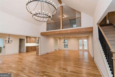 HUGE PRICE REDUCTION! LAKE HOME WITH 200 FEET OF SHORE LINE ON A - photo 10