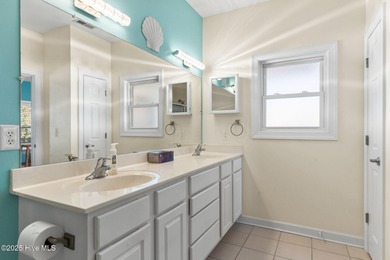 Welcome to 107 SE 71st Street, a coastal retreat nestled in the