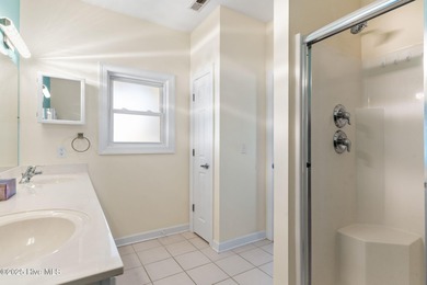 Welcome to 107 SE 71st Street, a coastal retreat nestled in the