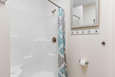 Welcome to 107 SE 71st Street, a coastal retreat nestled in the