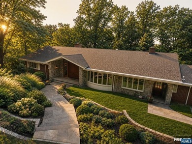 Beautifully updated ranch set atop a private 1.6-acre lot at the - photo 1