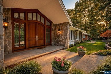 Beautifully updated ranch set atop a private 1.6-acre lot at the - photo 2