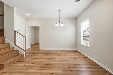 Nestled inside a desirable gated community, this beautifully