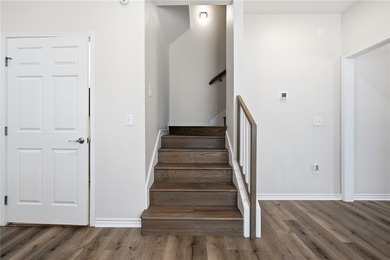 Nestled inside a desirable gated community, this beautifully