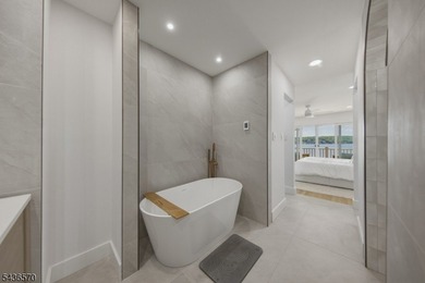 Welcome to this beautifully renovated lakefront retreat offering - photo 17