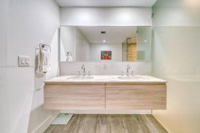 Experience breathtaking Biscayne Bay views from this 2 bed + den