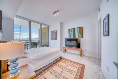 Experience breathtaking Biscayne Bay views from this 2 bed + den