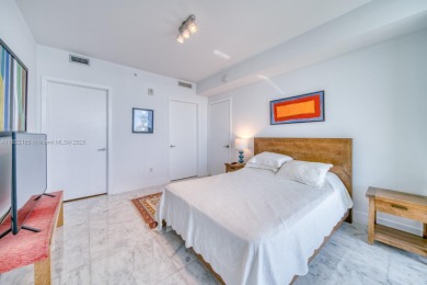 Experience breathtaking Biscayne Bay views from this 2 bed + den