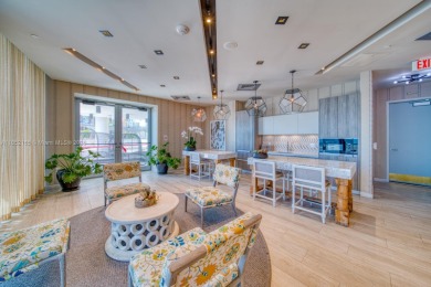 Experience breathtaking Biscayne Bay views from this 2 bed + den