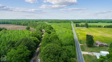 67.78 acres located on paved county road 114 just outside of the - photo 2