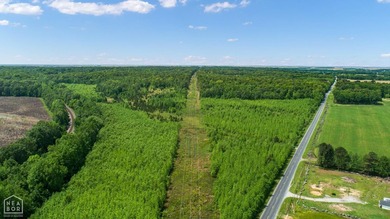 67.78 acres located on paved county road 114 just outside of the - photo 3