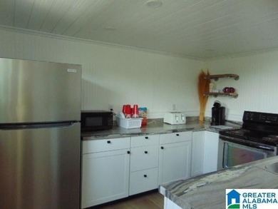 Lakefront Tiny Home with Stunning Views! Step into this charming - photo 3