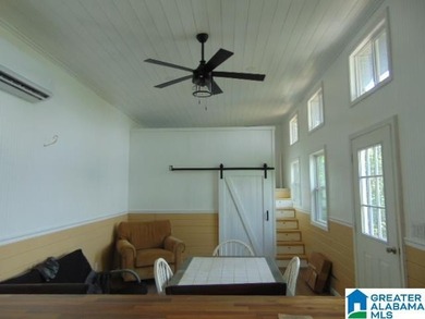 Lakefront Tiny Home with Stunning Views! Step into this charming - photo 5