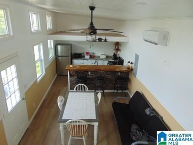Lakefront Tiny Home with Stunning Views! Step into this charming - photo 8