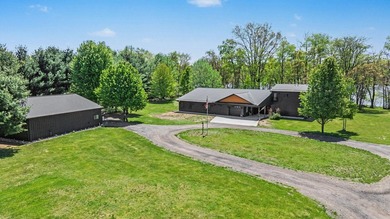PRICE REDUCED! Exceptional lakefront retreat on nearly 5 private - photo 4