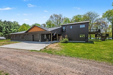 PRICE REDUCED! Exceptional lakefront retreat on nearly 5 private - photo 5