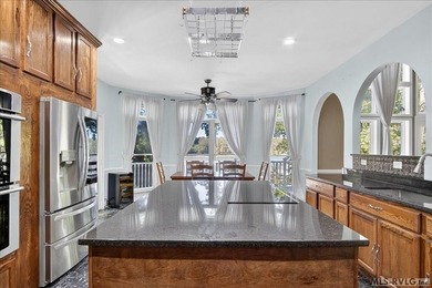 Experience expansive views of Kerr Lake from this impressive - photo 17