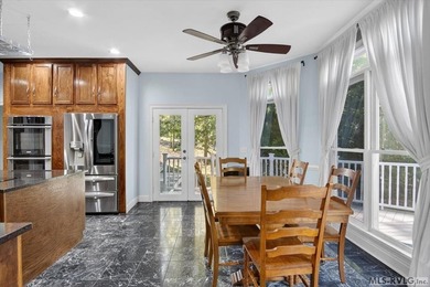 Experience expansive views of Kerr Lake from this impressive - photo 19