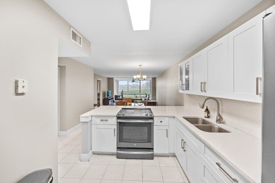 Wake up to tranquil lake and golf course views in this - photo 4