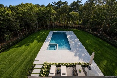 Set on 1.25 professionally landscaped acres bordering protected - photo 2