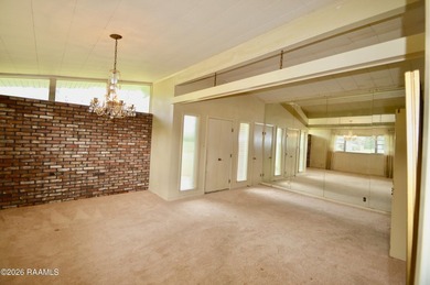 Welcome to a rare bayou-front opportunity offering privacy