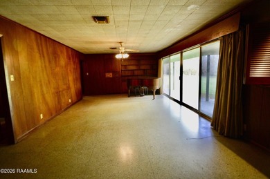 Welcome to a rare bayou-front opportunity offering privacy