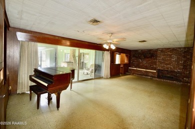 Welcome to a rare bayou-front opportunity offering privacy