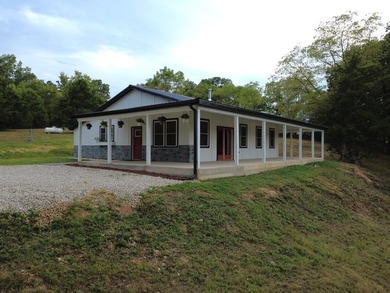 Tucked away in the Ozark hills is this modern farmhouse getaway - photo 33