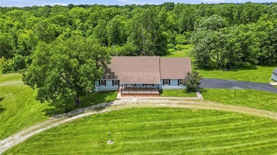 Nestled on 4.6 scenic ACRES and backing to peaceful woods, this - photo 3