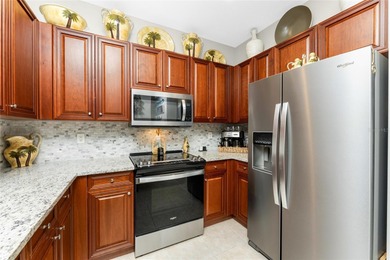 This striking tropical oasis drenched with Florida sunshine will - photo 8
