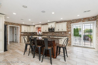 Welcome to 699 Ionia Avenue, a stunning brick-front center hall - photo 13