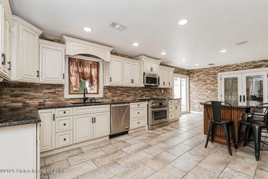 Welcome to 699 Ionia Avenue, a stunning brick-front center hall - photo 18
