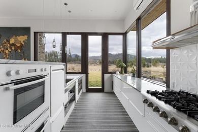 Set on nearly nine private acres in The Ranch at Riverbend, this - photo 24